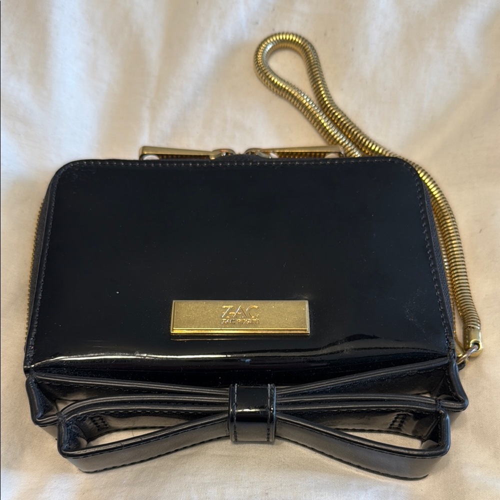 Zac Posen Black and Gold Clutch with Textured Bow and Metal Frame